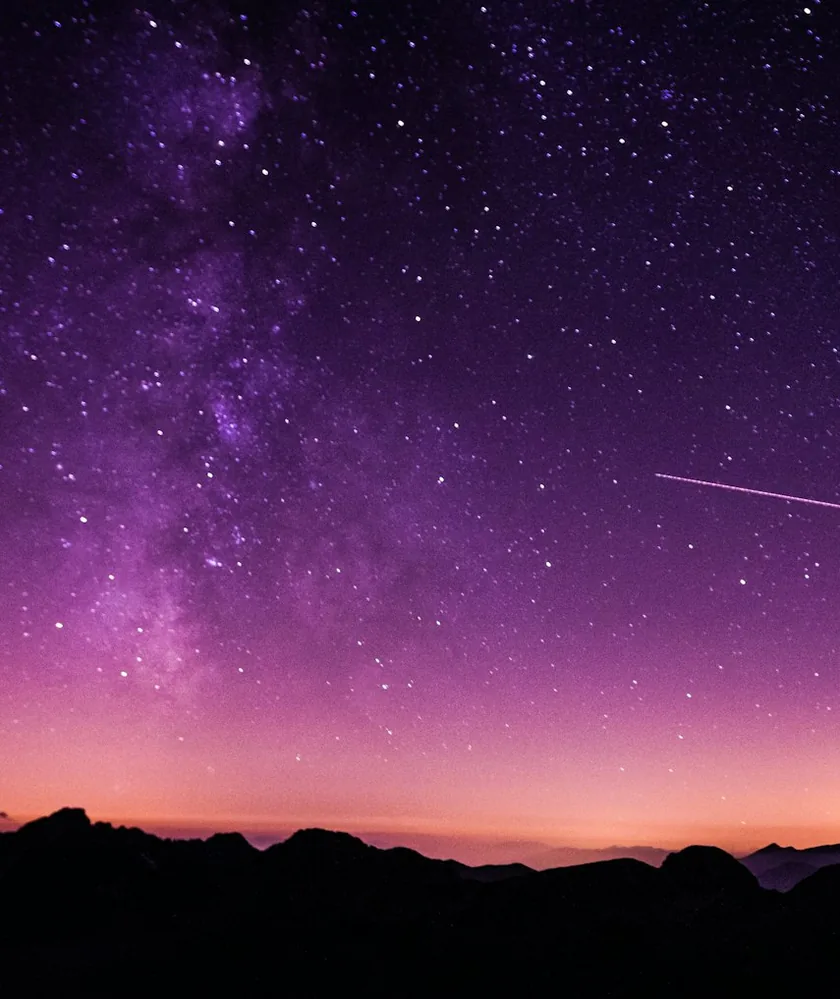 Starry sky and Milky Way over mountains